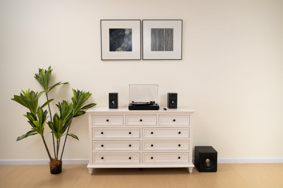 EDIFIER S355DB Black 2.1 speaker system with a turntable on a white sideboard