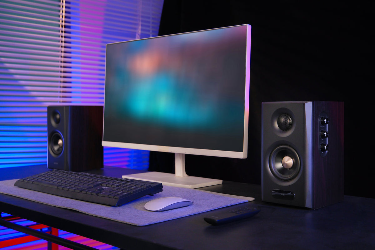 EDIFIER S355DB Walnut 2.1 speaker system on a gaming desk