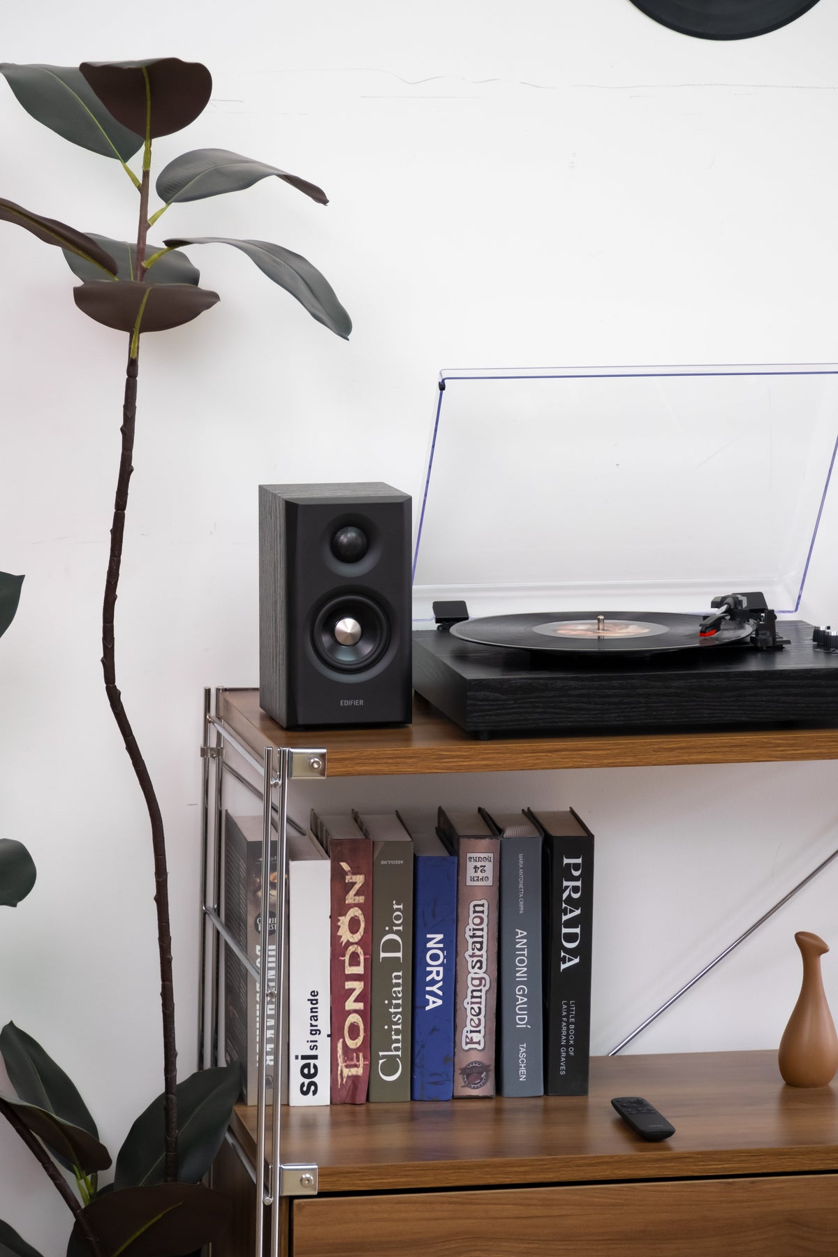 EDIFIER S355DB Black 2.1 speaker system satellite speaker beside a turntable