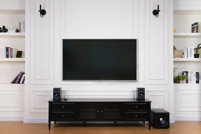 EDIFIER S355DB Walnut 2.1 speaker system in a bright living room TV setup