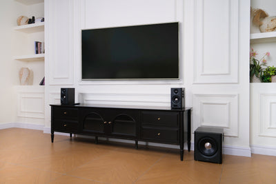 EDIFIER S355DB Walnut 2.1 speaker system in a bright living room with wireless subwoofer