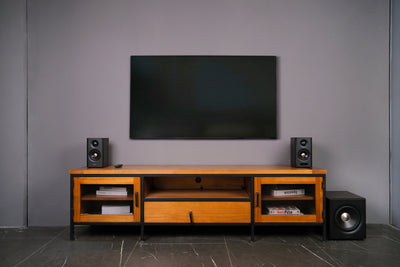 EDIFIER S355DB Walnut 2.1 speaker system in a modern TV room