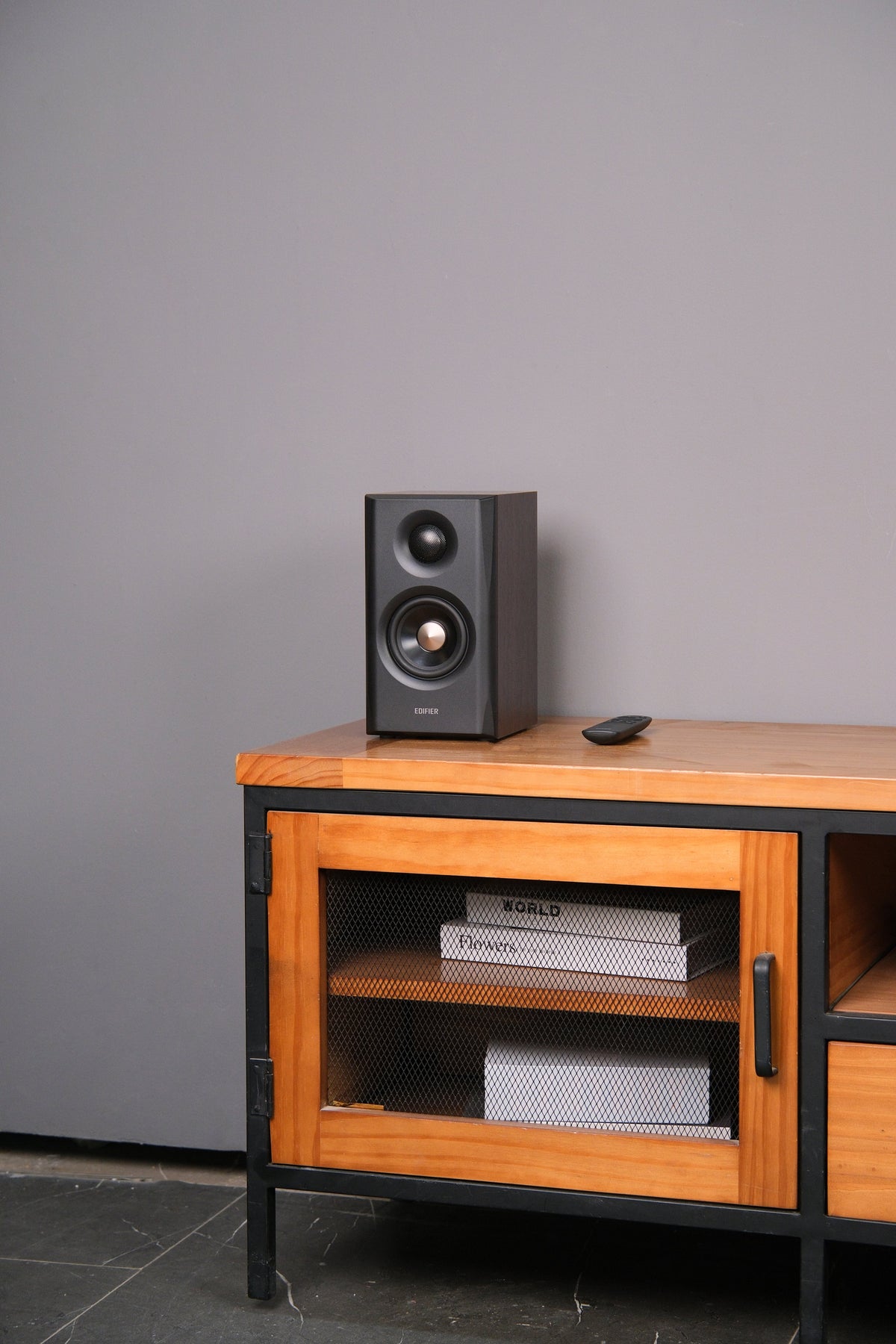 EDIFIER S355DB Walnut 2.1 speaker system satellite speaker on a media cabinet