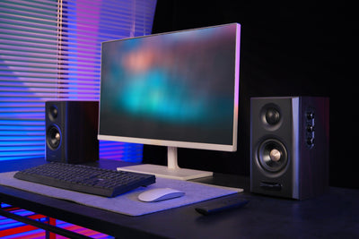EDIFIER S355DB Walnut 2.1 speaker system on a gaming desk